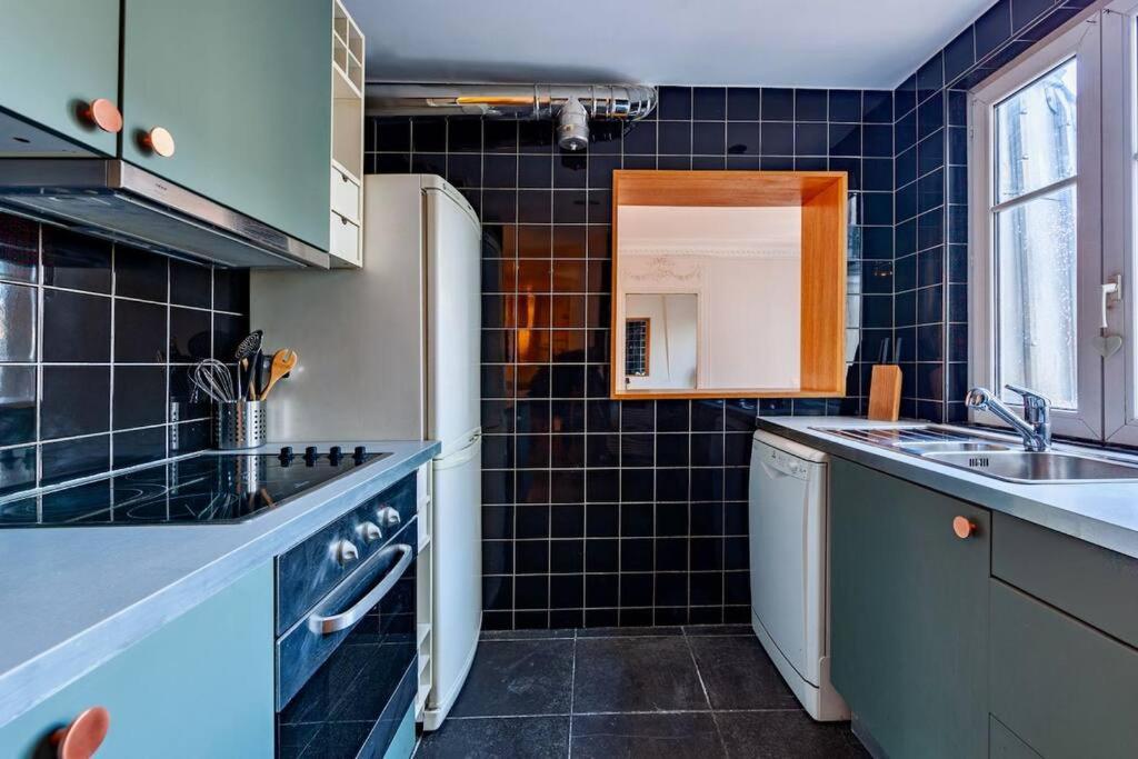 Charmant Appartement Au Coeur De Parigi Esterno foto